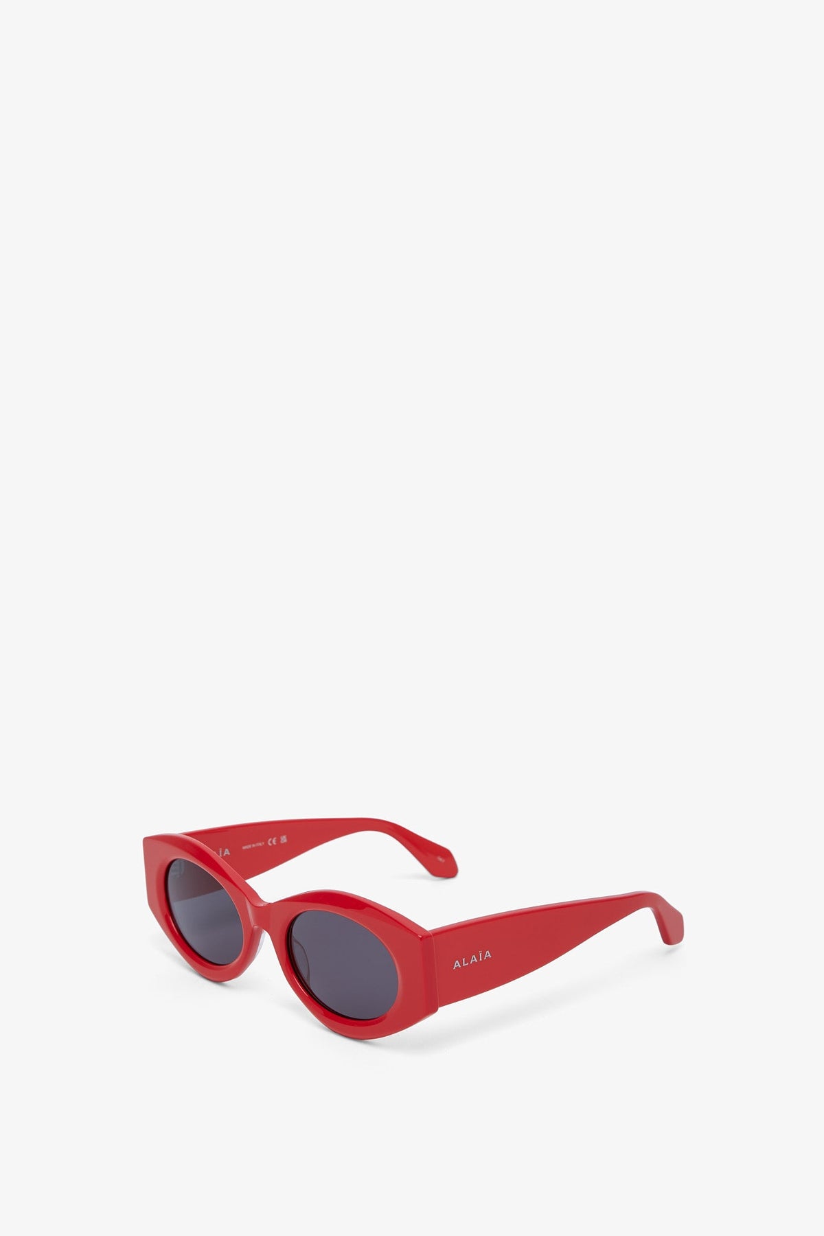 Shop Alaïa Oval 82 Red Sunglasses