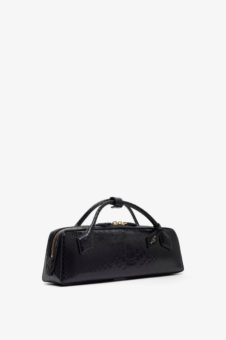 Le Teckel black shiny python clutch