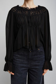 Scoop-neck cropped black top in silk